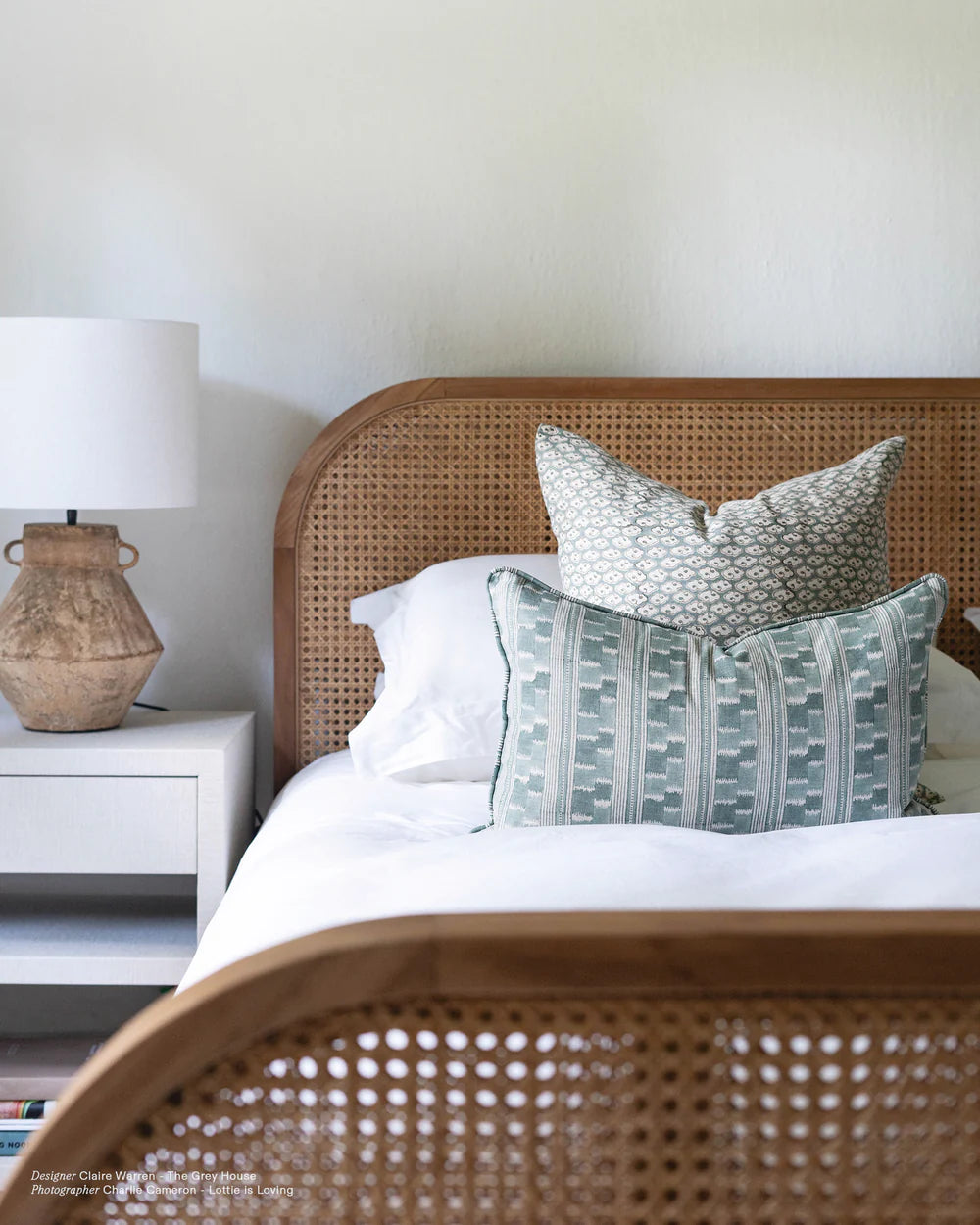 celadon cushions on rattan bed