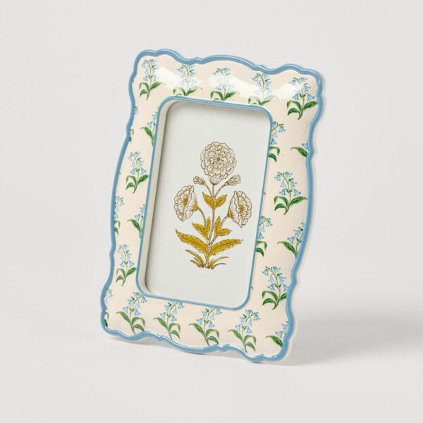 Decorative picture frame with floral design on a white background