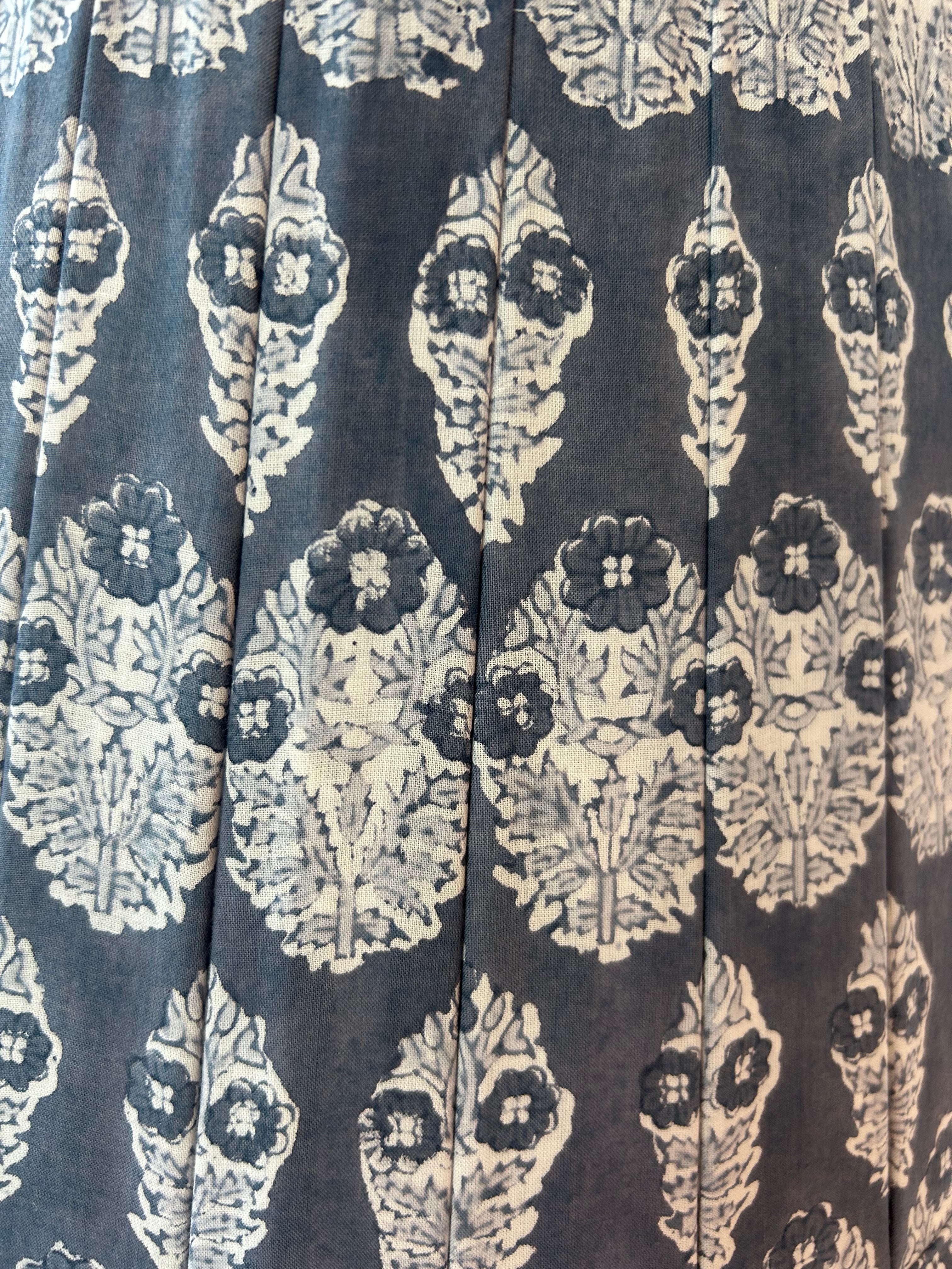 Patterned fabric with white designs on a dark background