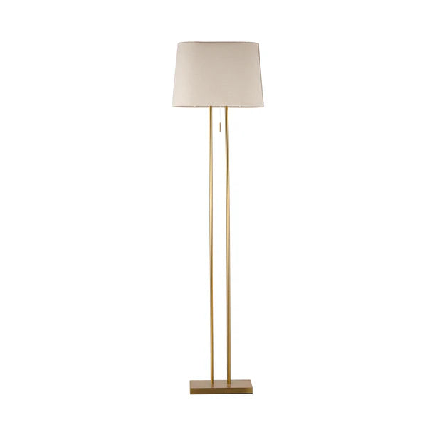 oval shade and brass base floor lamp