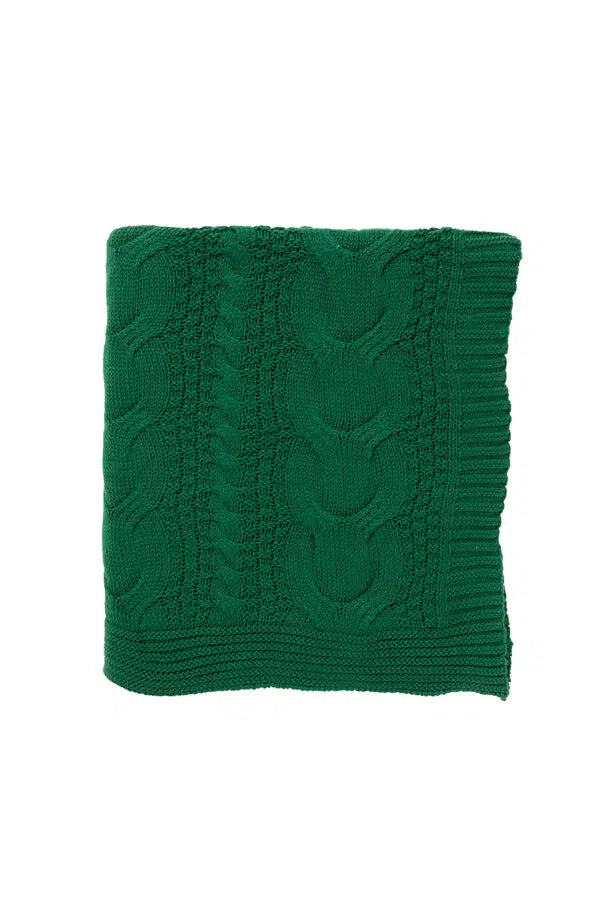Green knitted cotton throw on a white background