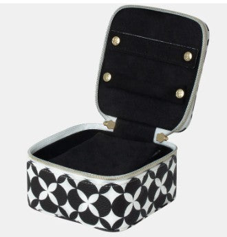 Black and white geometric patterned jewelry box with open lid on a white background