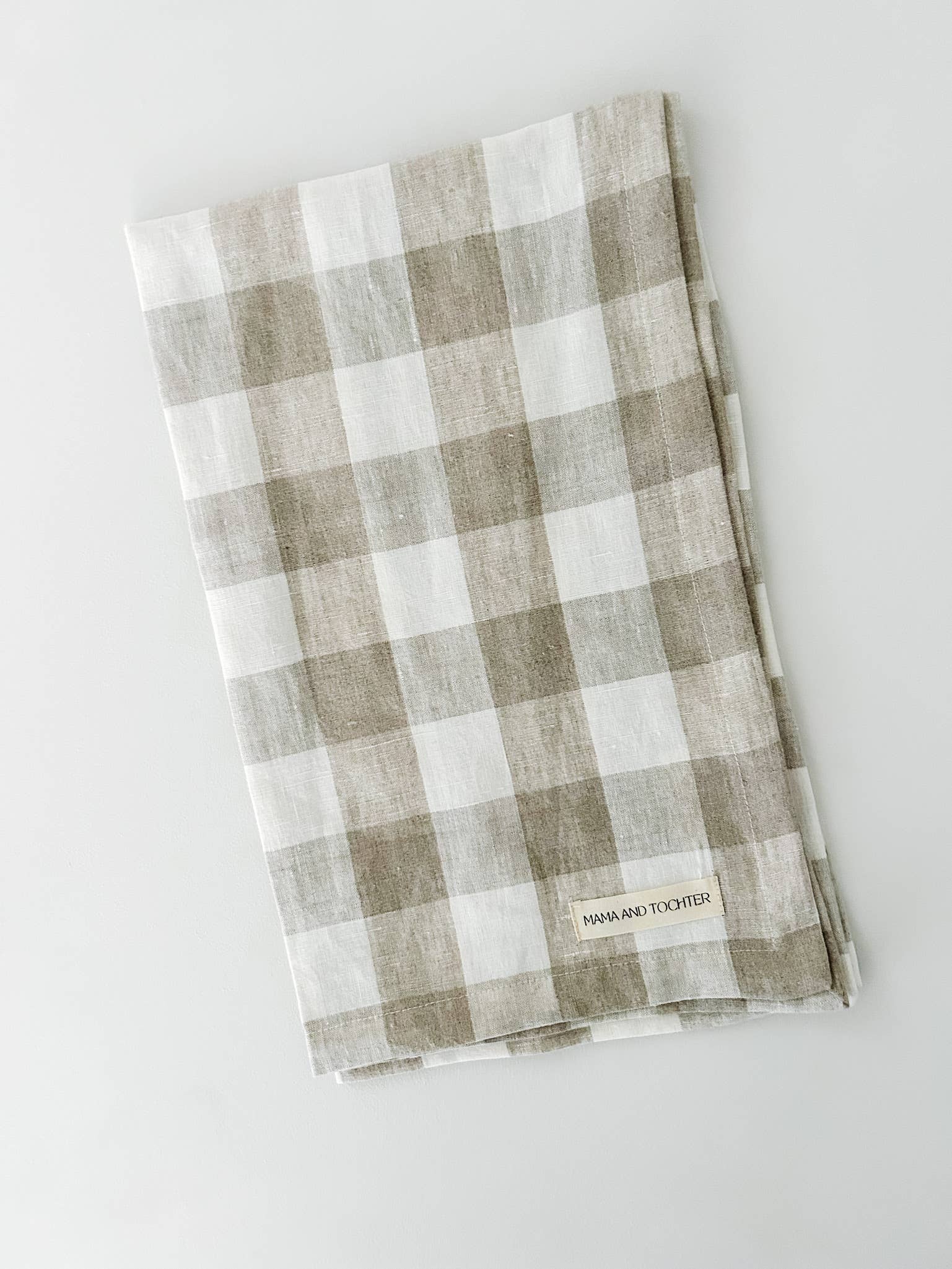 Checkered towel with brand label on a white background