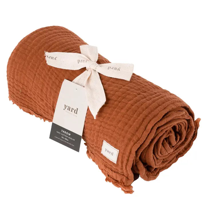 Brown textured throw blanket with 'yard' branding on a white background