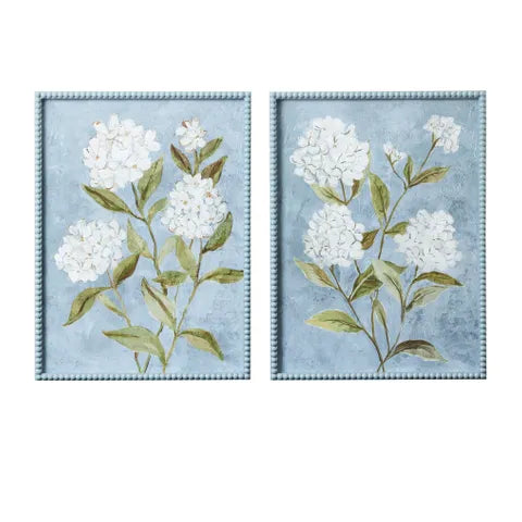 Two floral wall art pieces with white flowers and green leaves on a light blue background.