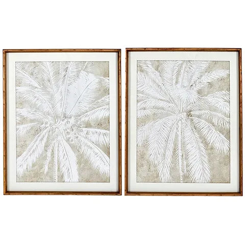 Two framed palm leaf prints on a white background