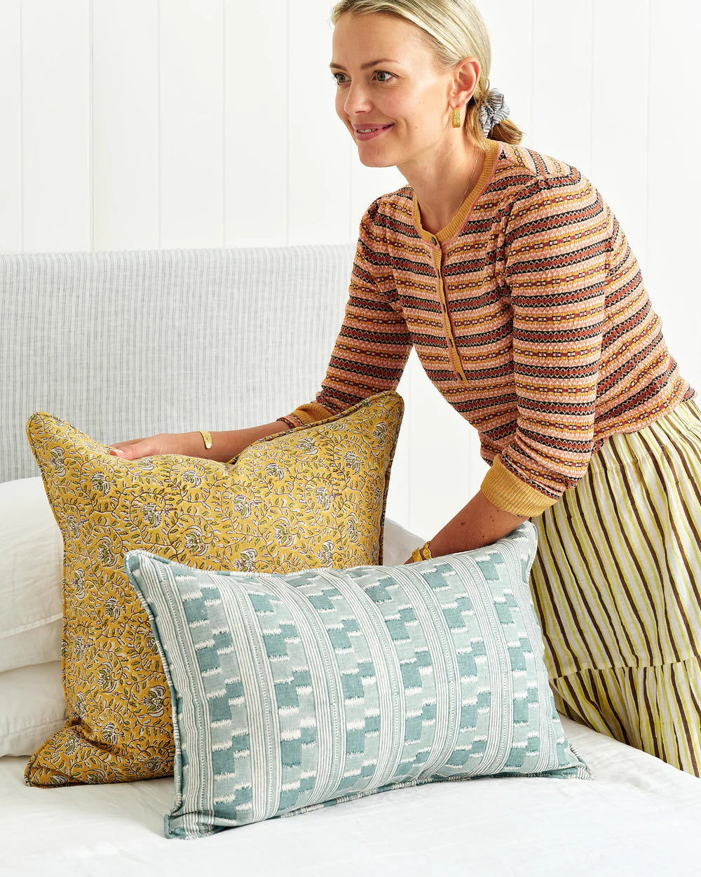 arranging 2 cushions - yellow and blue